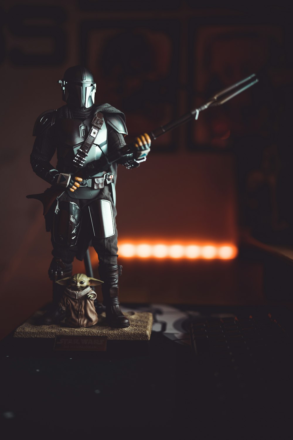 a statue of a man holding a sword on top of a table