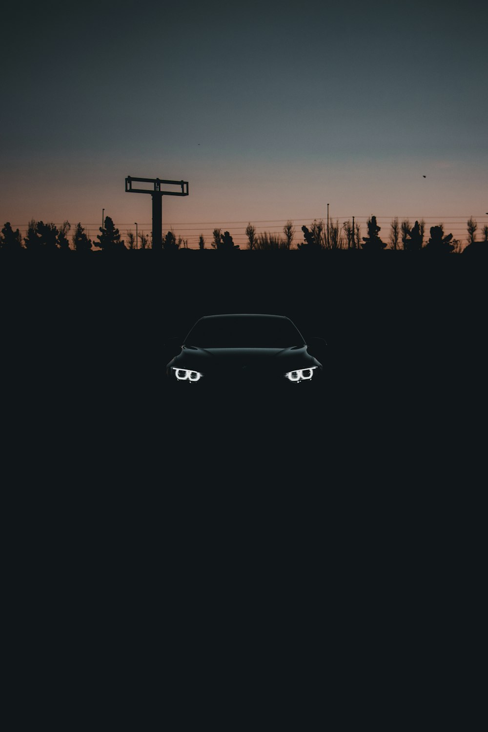 a car parked in a field at night