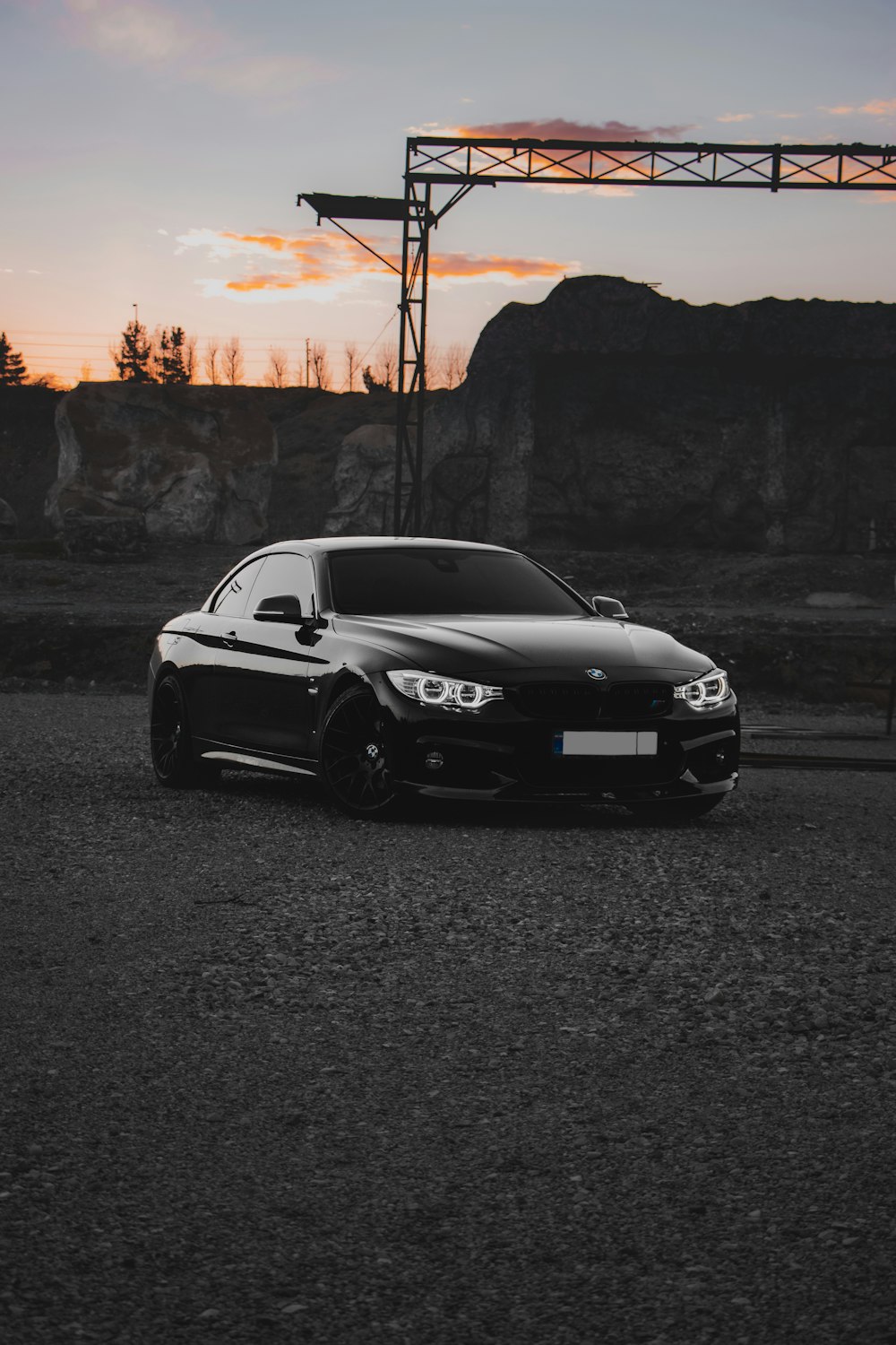 a black car parked in a parking lot