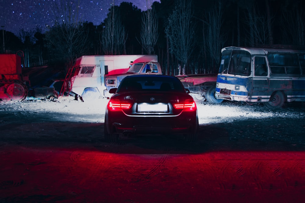 a car parked in a parking lot at night