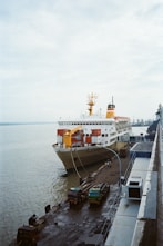a large cruise ship docked at a dock