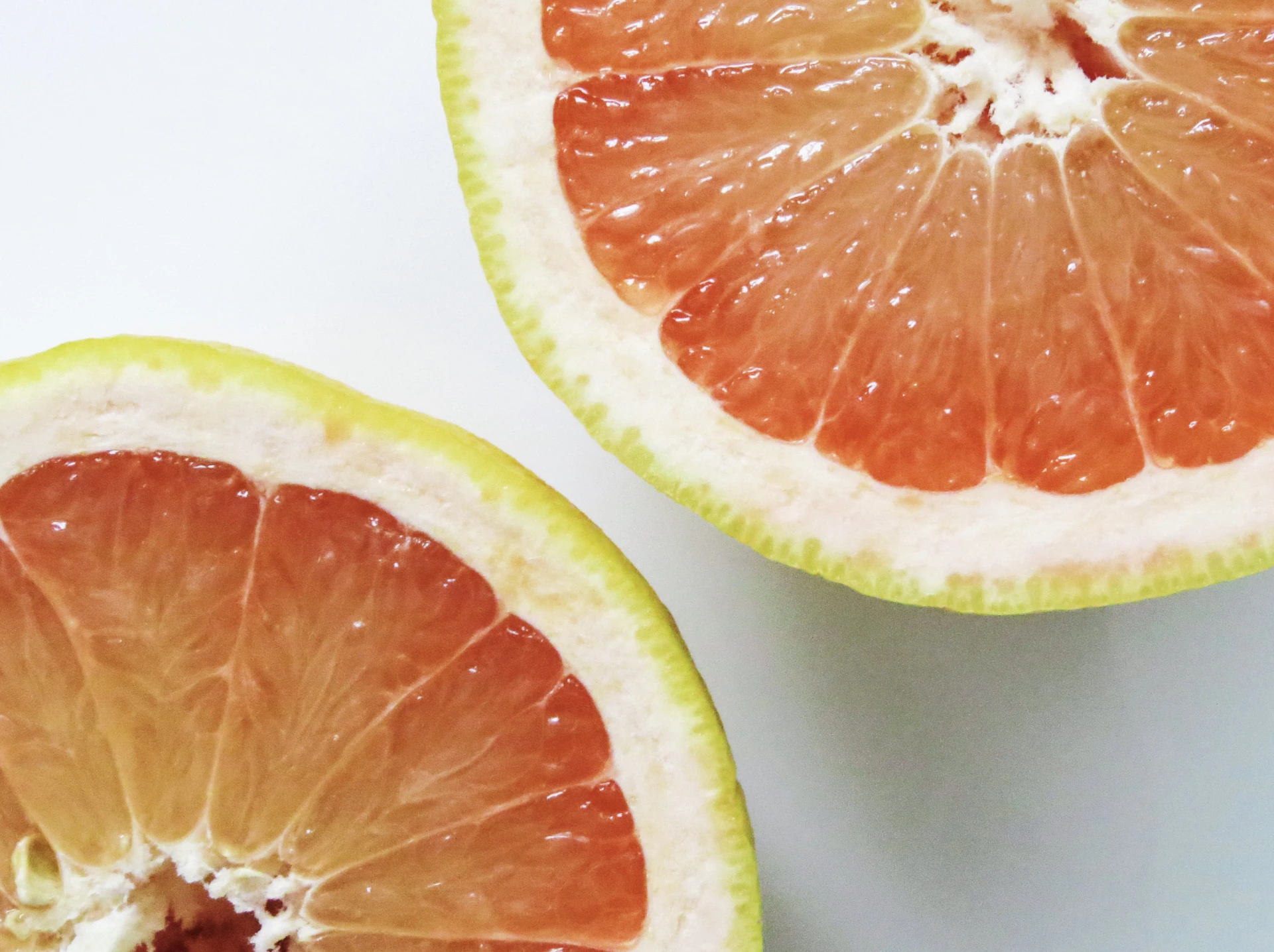 two halves of a grapefruit cut in half