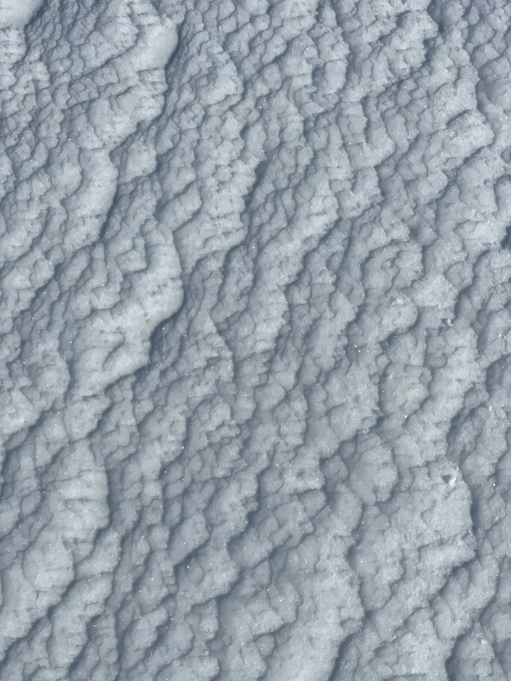 an aerial view of a snow covered landscape