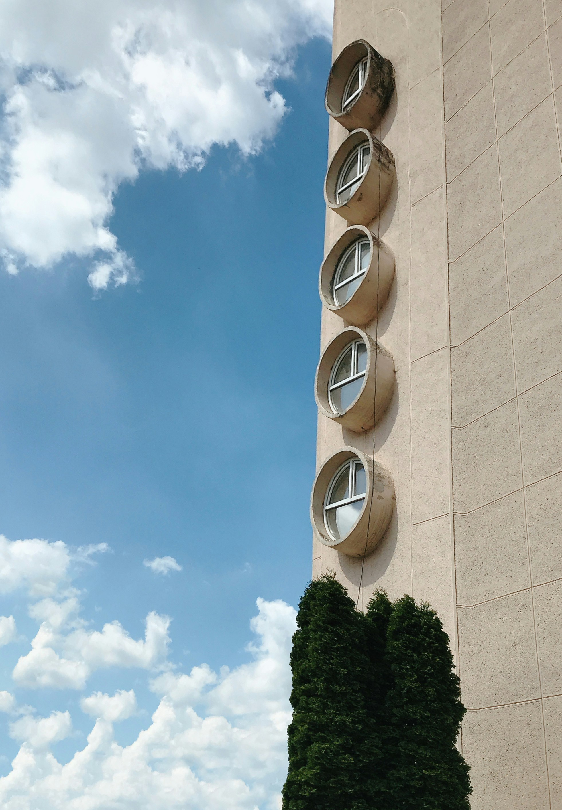 a tall building with a clock on the side of it