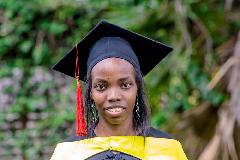 a woman in a graduation cap and gown