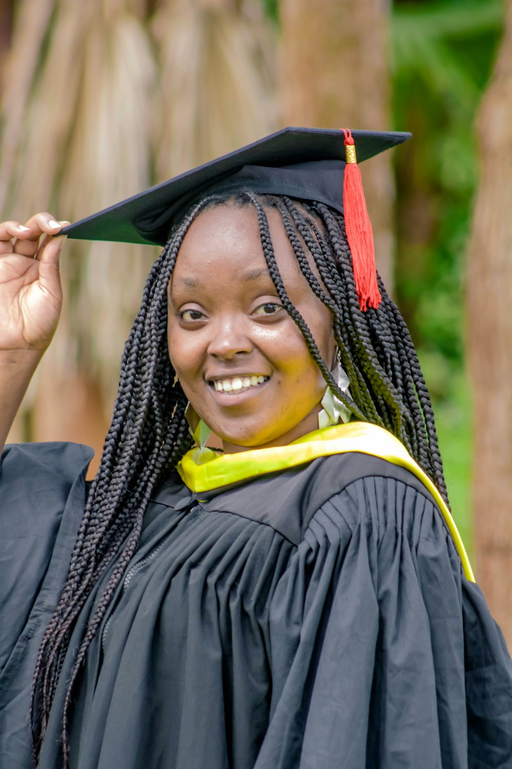 a woman in a graduation cap and gown