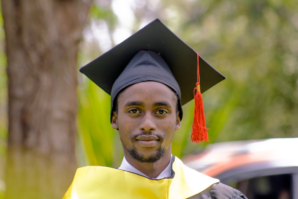 a man in a graduation cap and gown