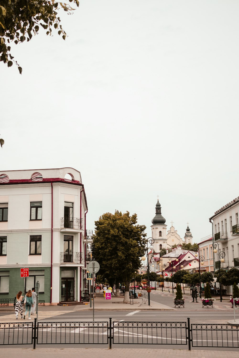 a white building with a red stripe on the top of it