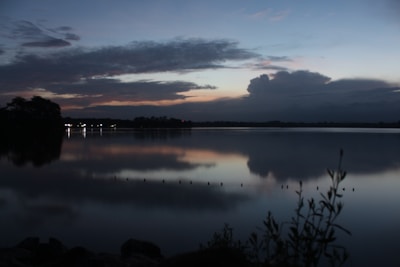 A serene lakeside at dusk, the perfect backdrop for a suspenseful tale in the making.
