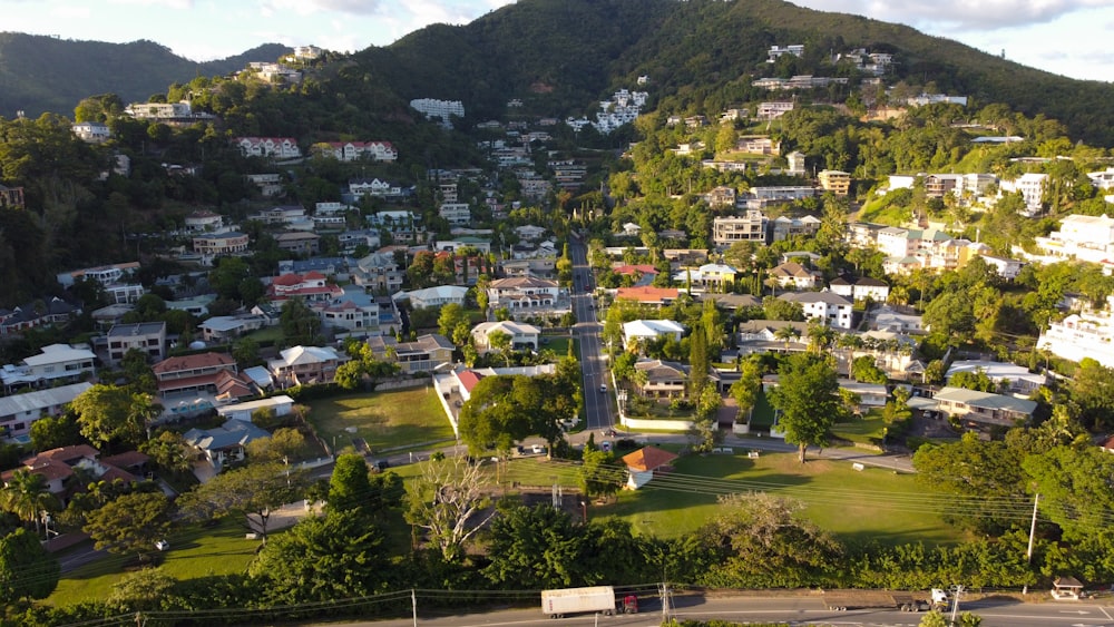 an aerial view of a city with a mountain in the background