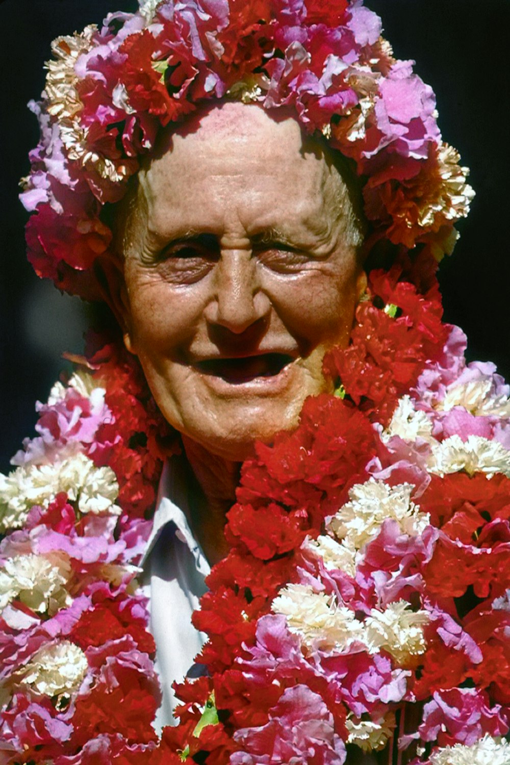 a man with a flower crown on his head