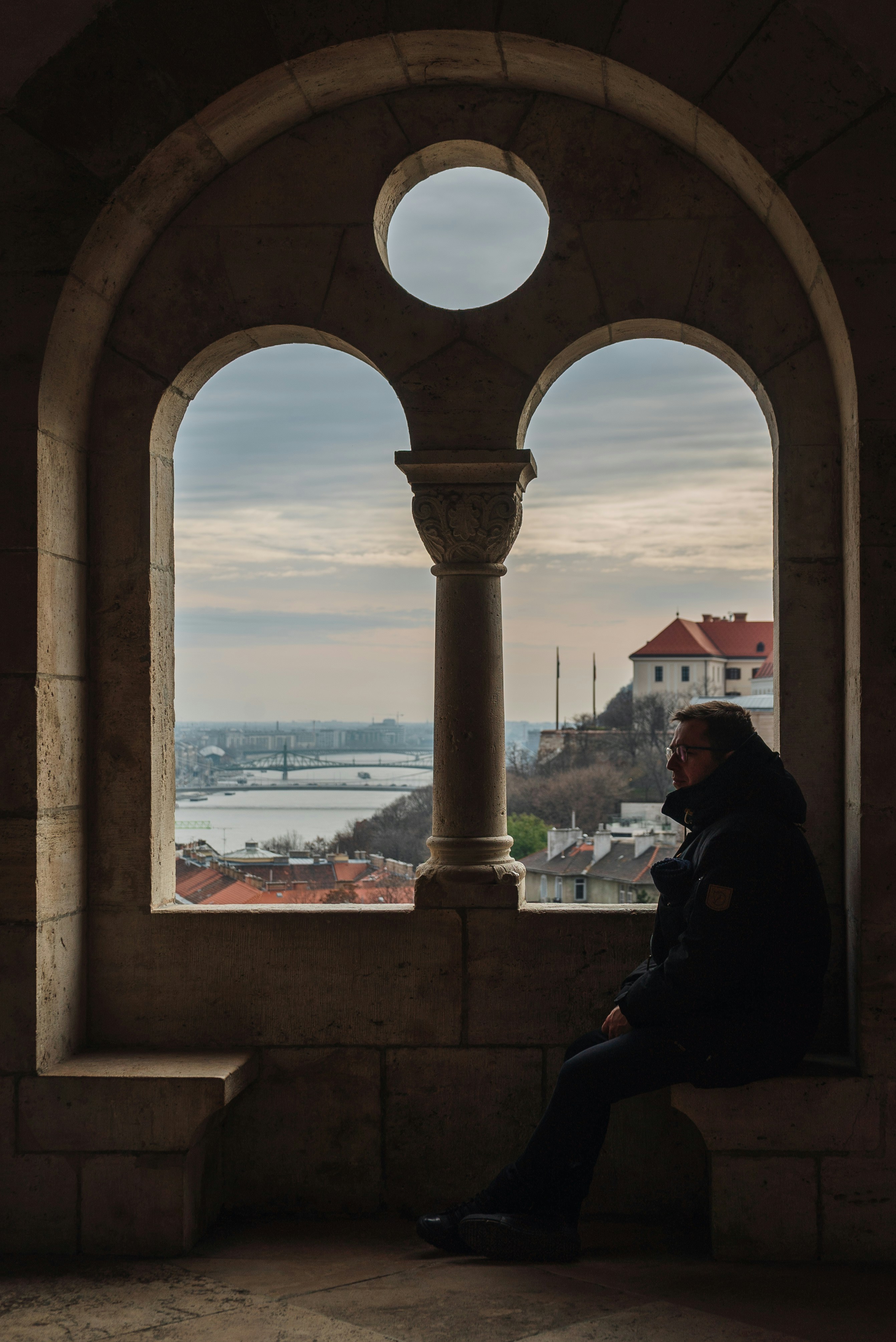 a man standing in front of a window