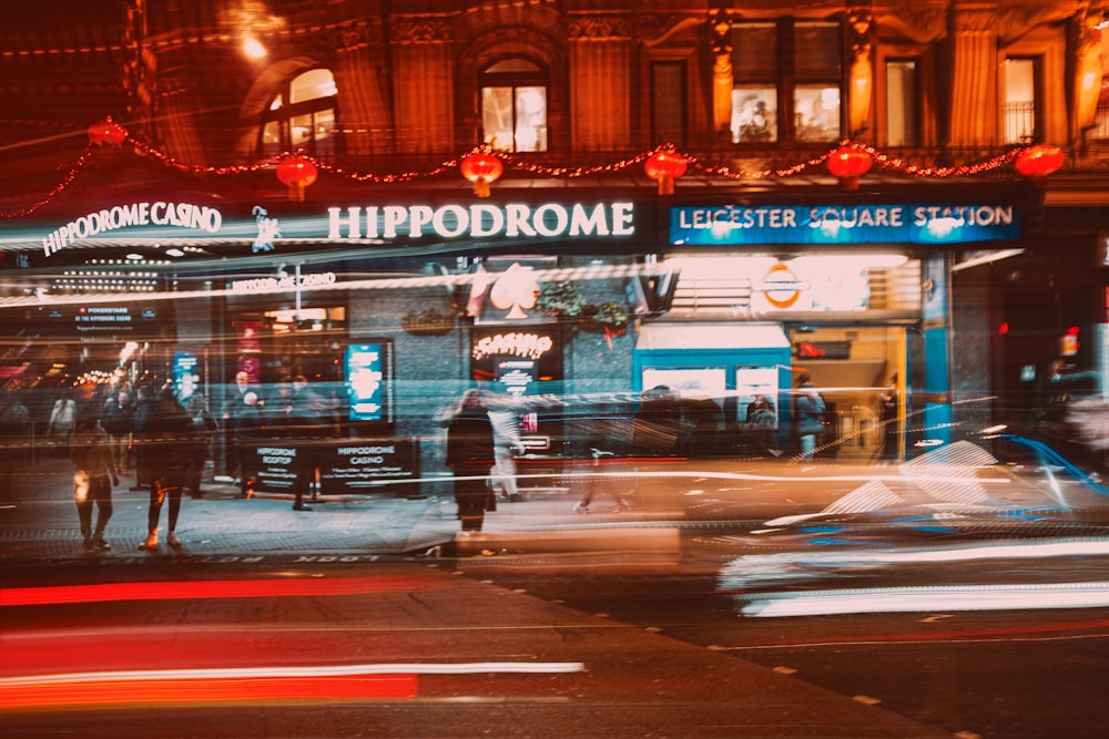 a blurry photo of a street corner at night