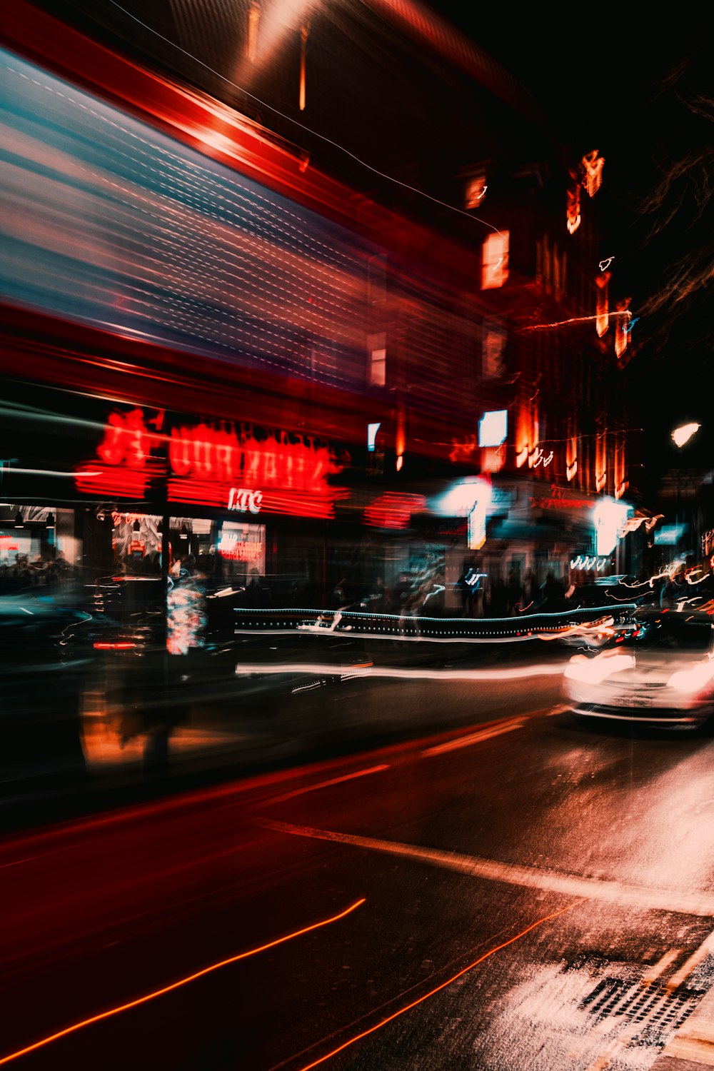 a blurry photo of a city street at night