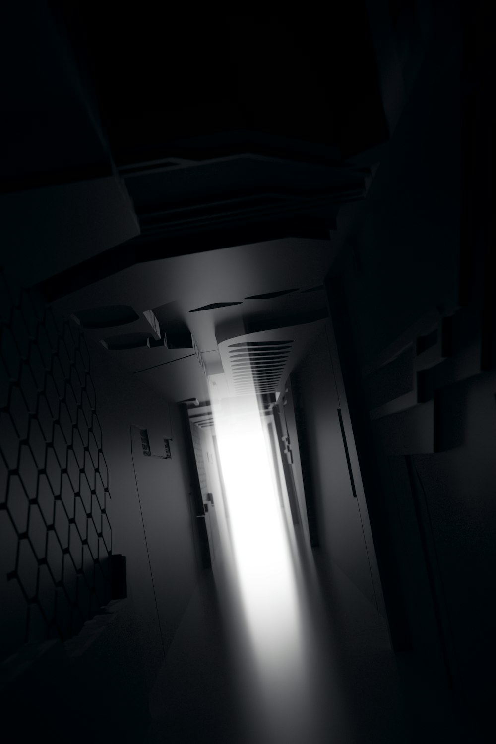 a dark hallway with a light coming through it