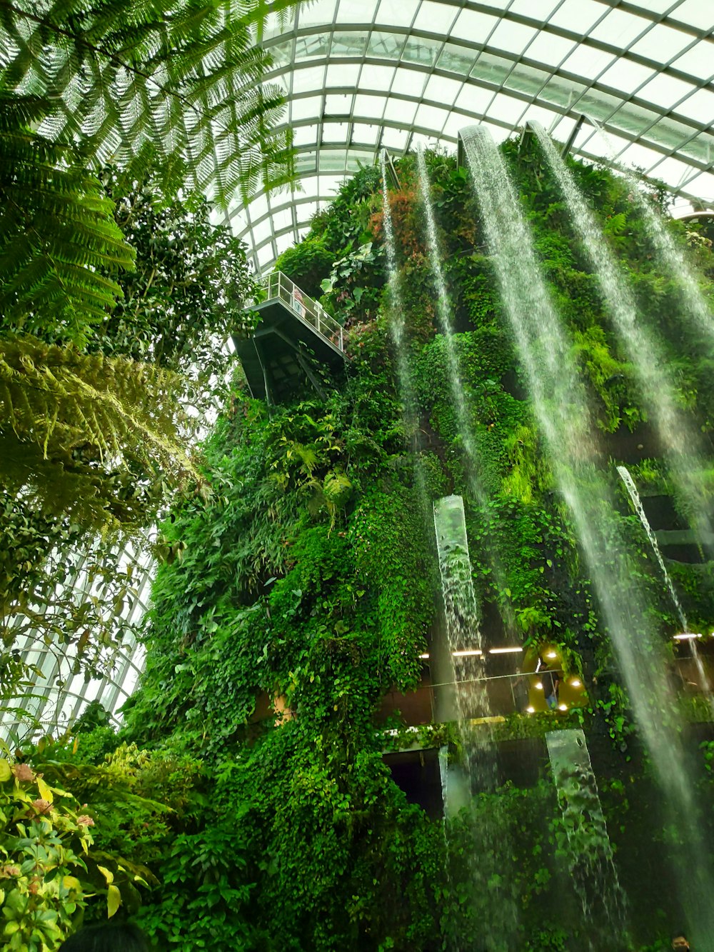 an indoor waterfall in the middle of a building