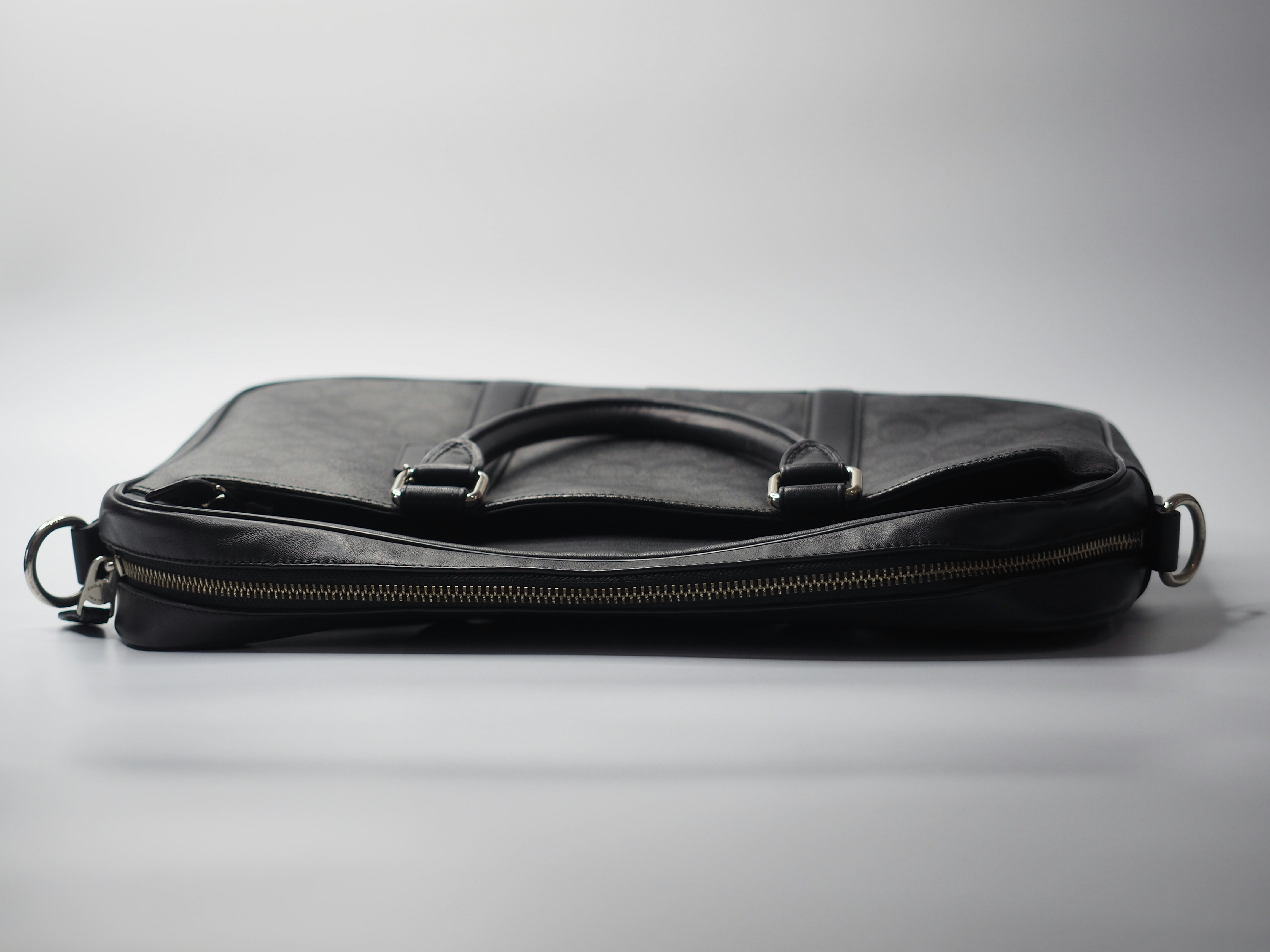 a black bag with a zipper on the inside of it