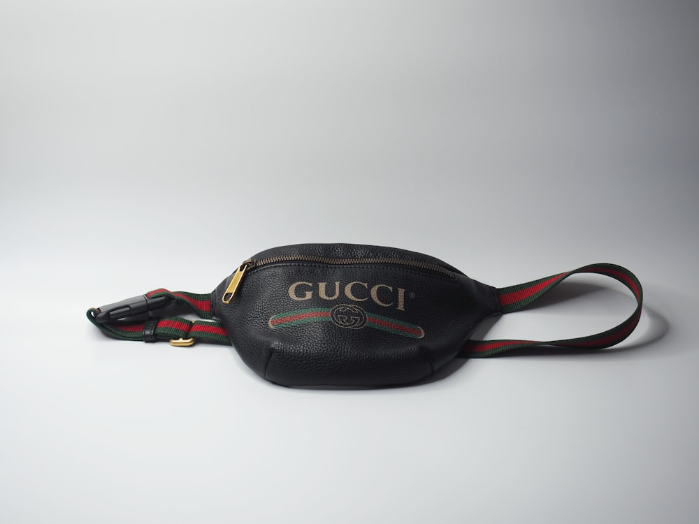 a gucci belt bag on a white background