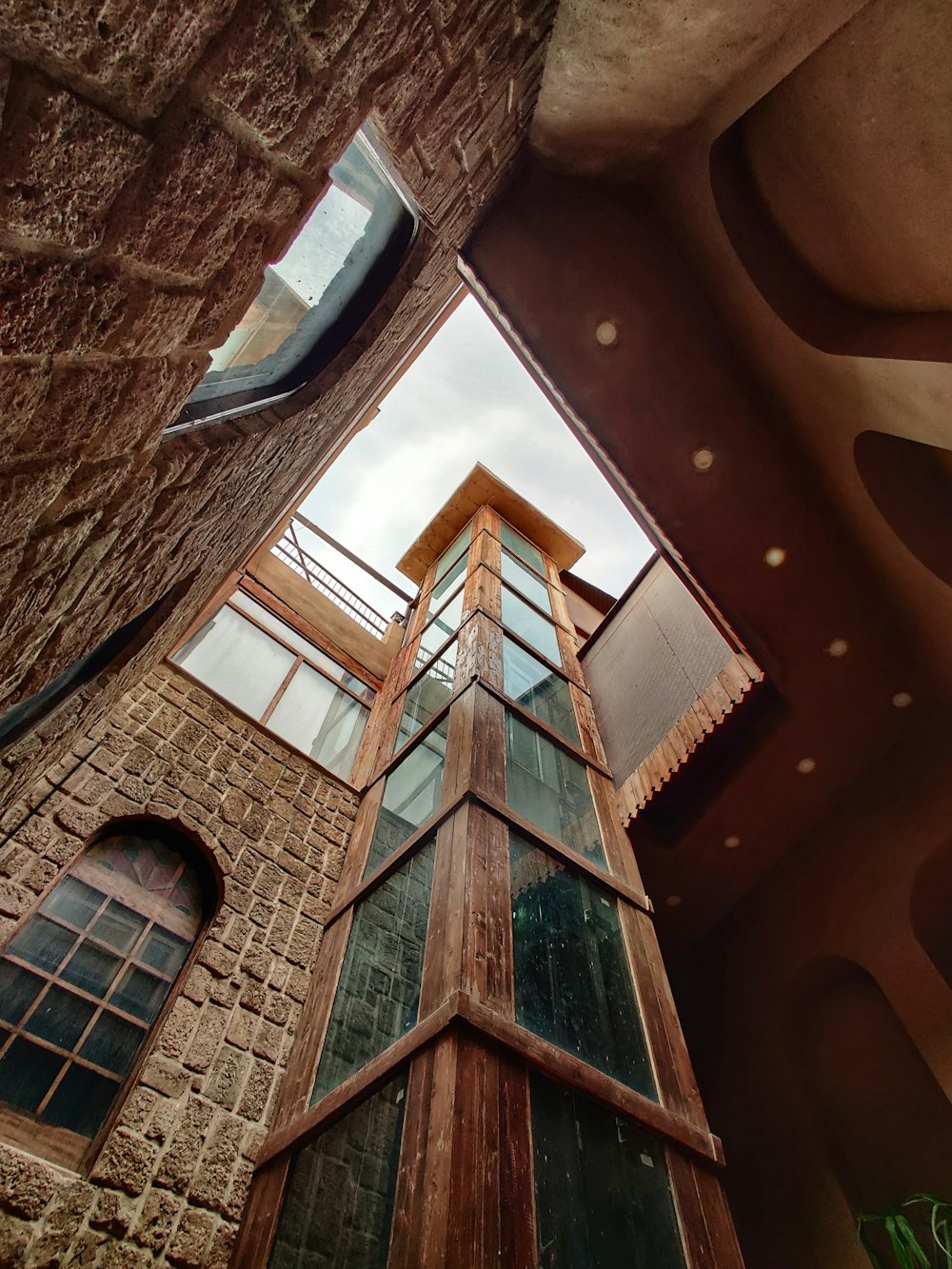 a tall brick building with a skylight above it