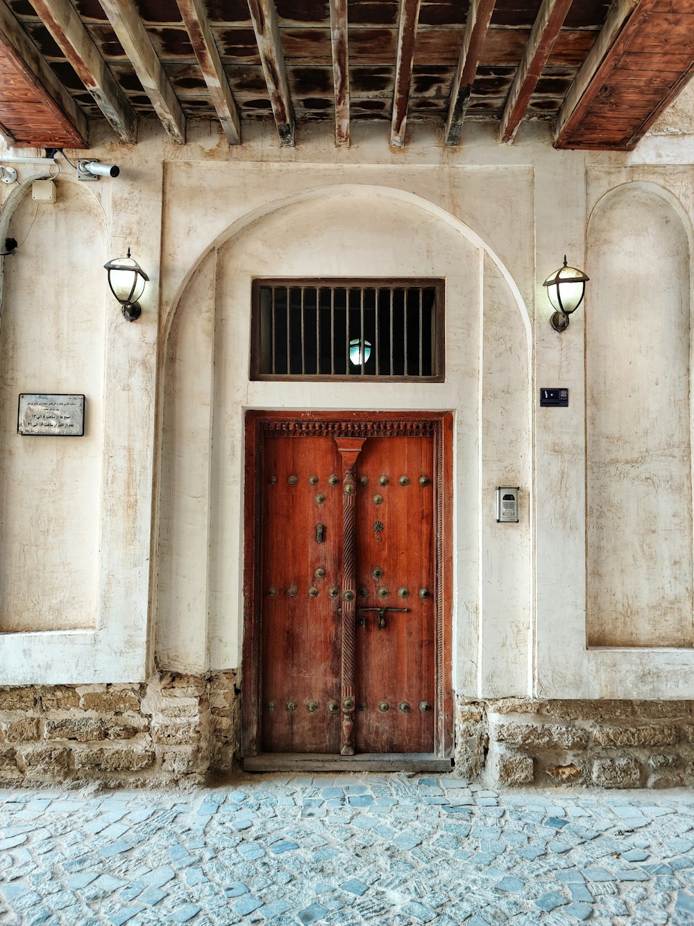 a large wooden door in a stone building