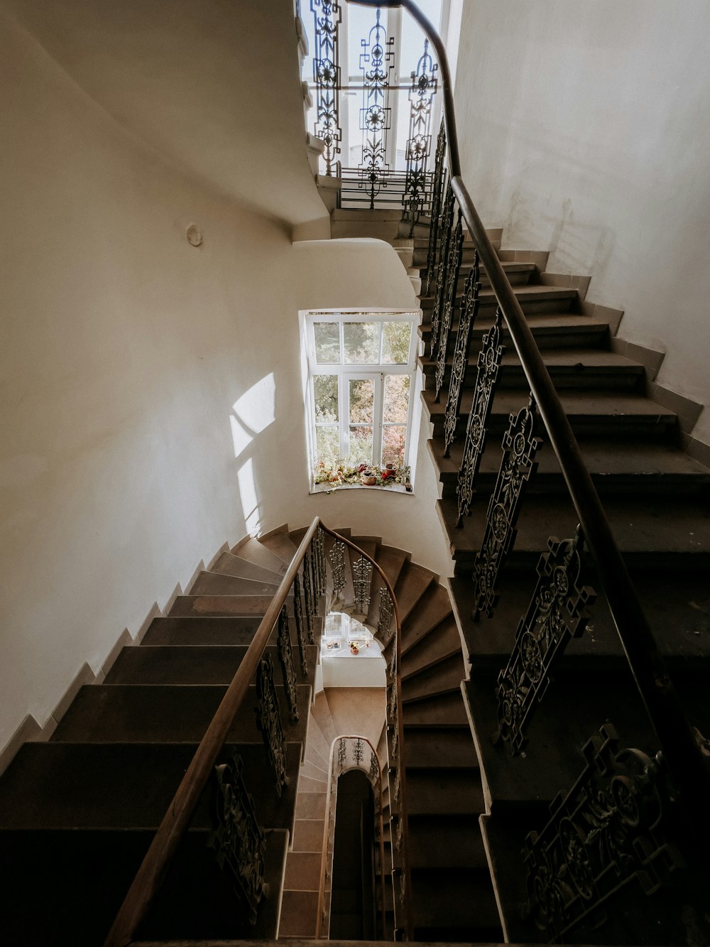 a stair case with a window on the top of it