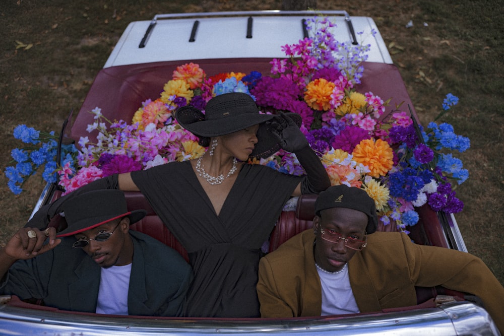 a group of people sitting in the back of a car