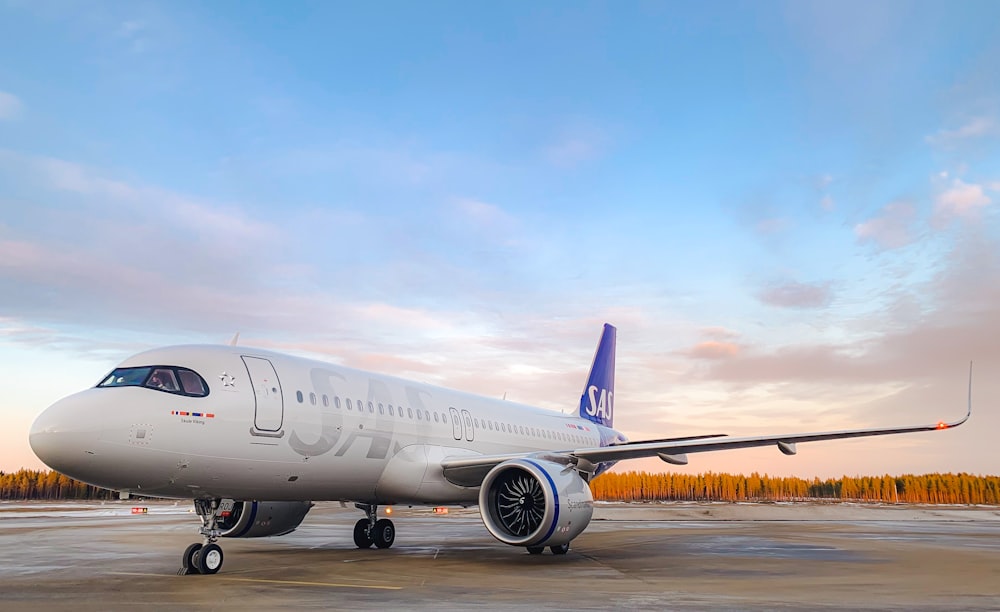 a large jetliner sitting on top of an airport tarmac