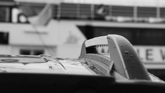 Close-up of a car roof covered in small dents from a recent hailstorm.