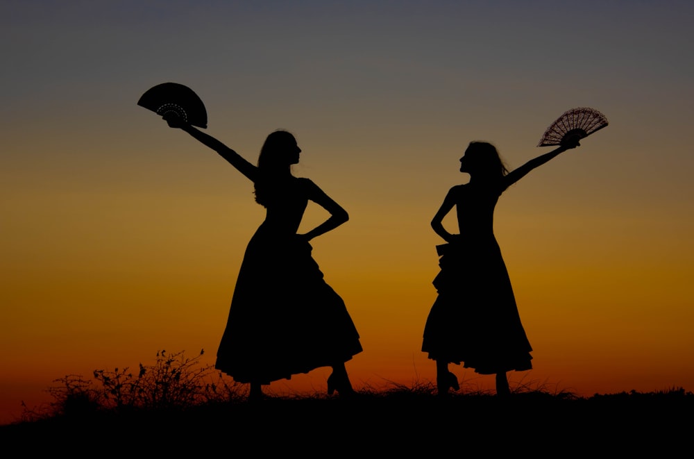 a couple of women standing next to each other