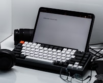 A neatly arranged workspace featuring a tablet showing a polished presentation slide.