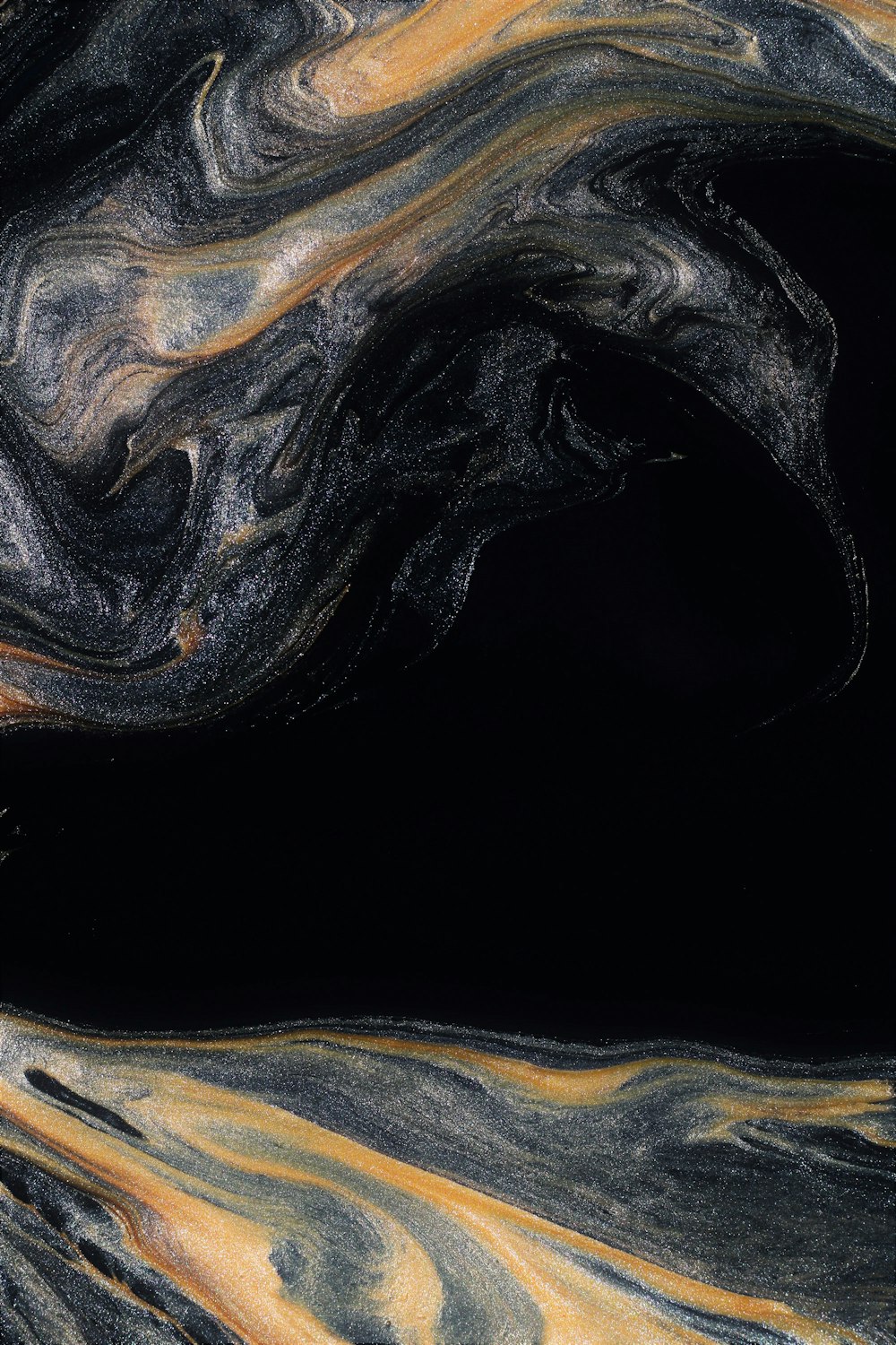 a close up of a black and yellow swirl
