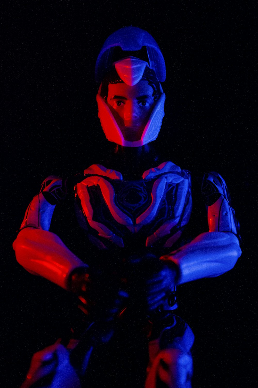 a man in a futuristic suit with his arms crossed