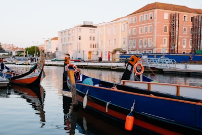 a boat is docked next to a body of water