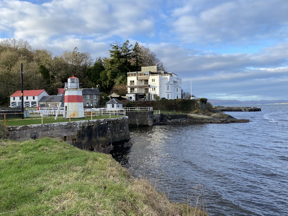 a body of water with houses on the shore