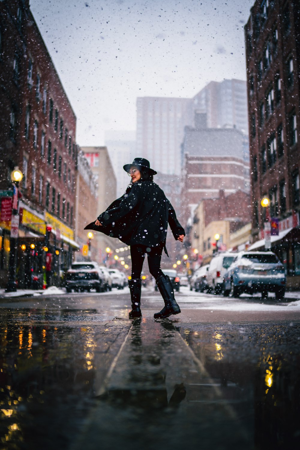 a man walking down the street in the rain