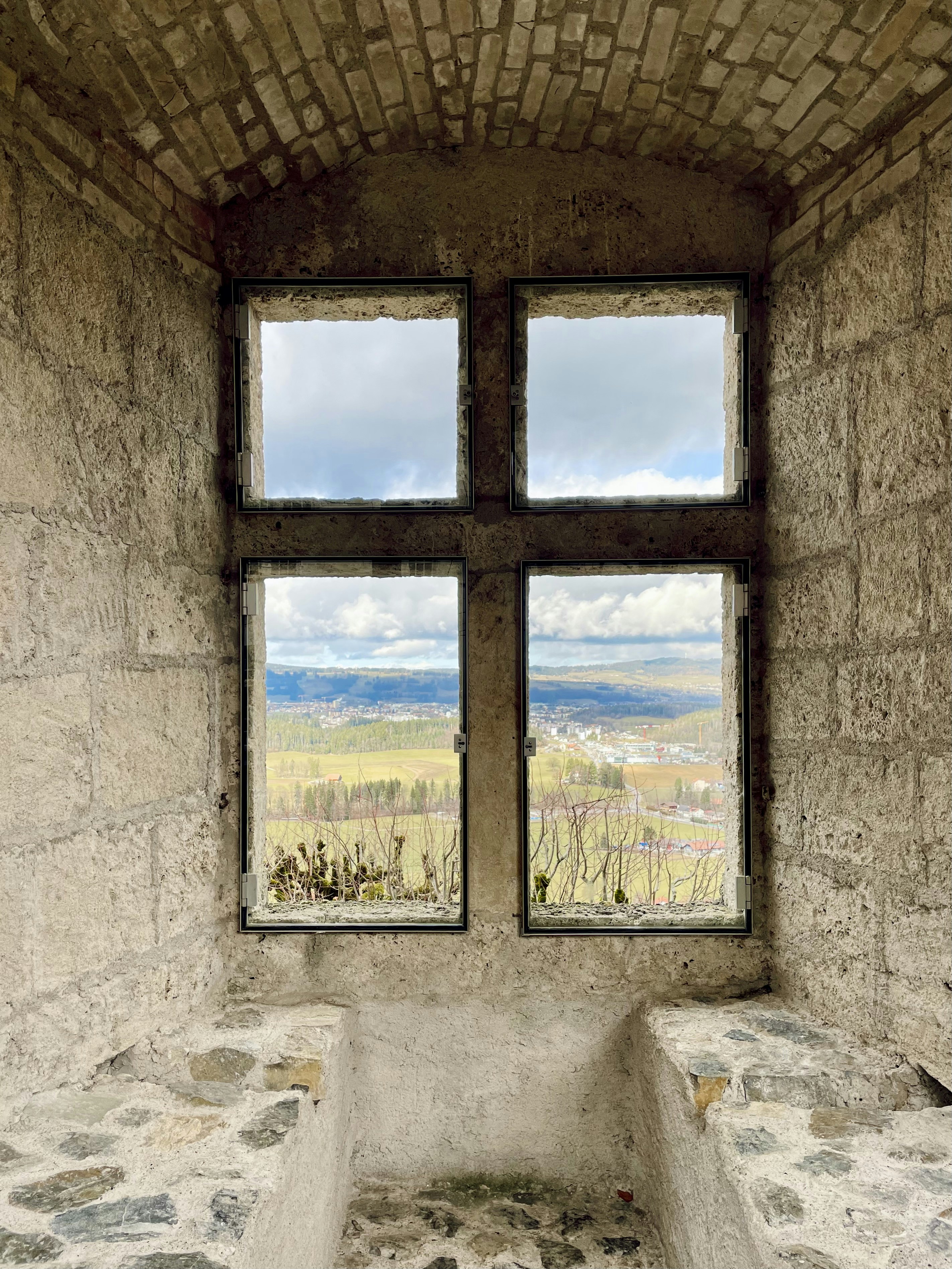A window in a stone building with a bench in front of it photo – Free ...