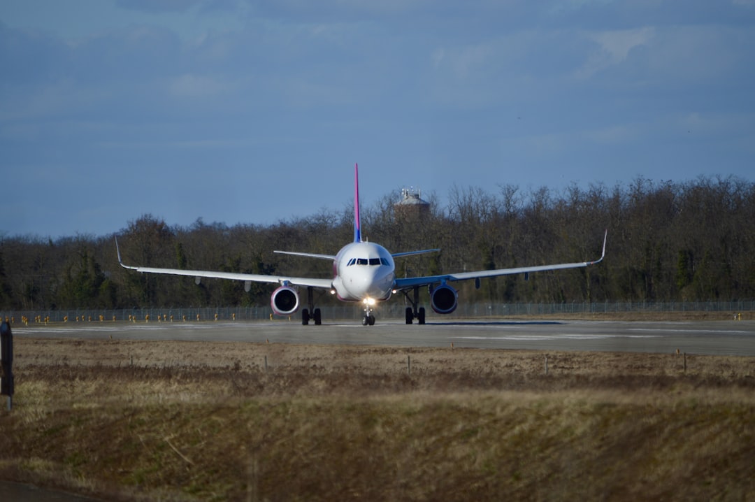 a large jetliner sitting on top of an airport runway,