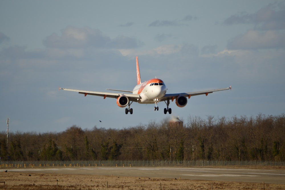 an airplane taking off from an airport runway
