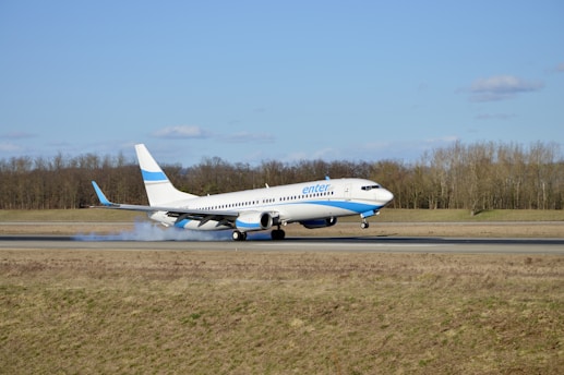 a large jetliner taking off from an airport runway
