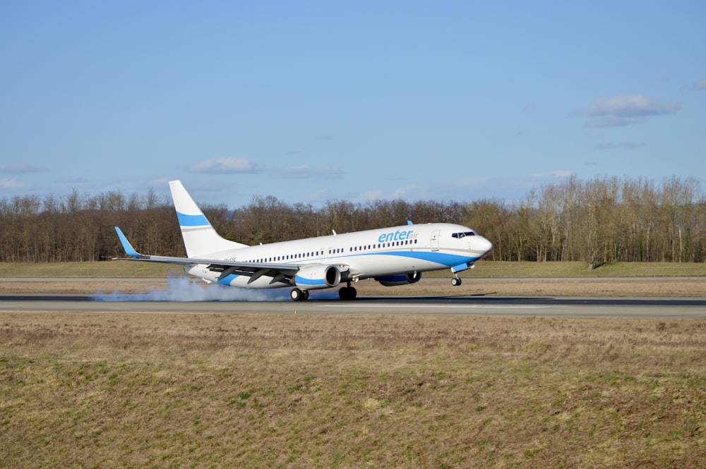 a large jetliner taking off from an airport runway