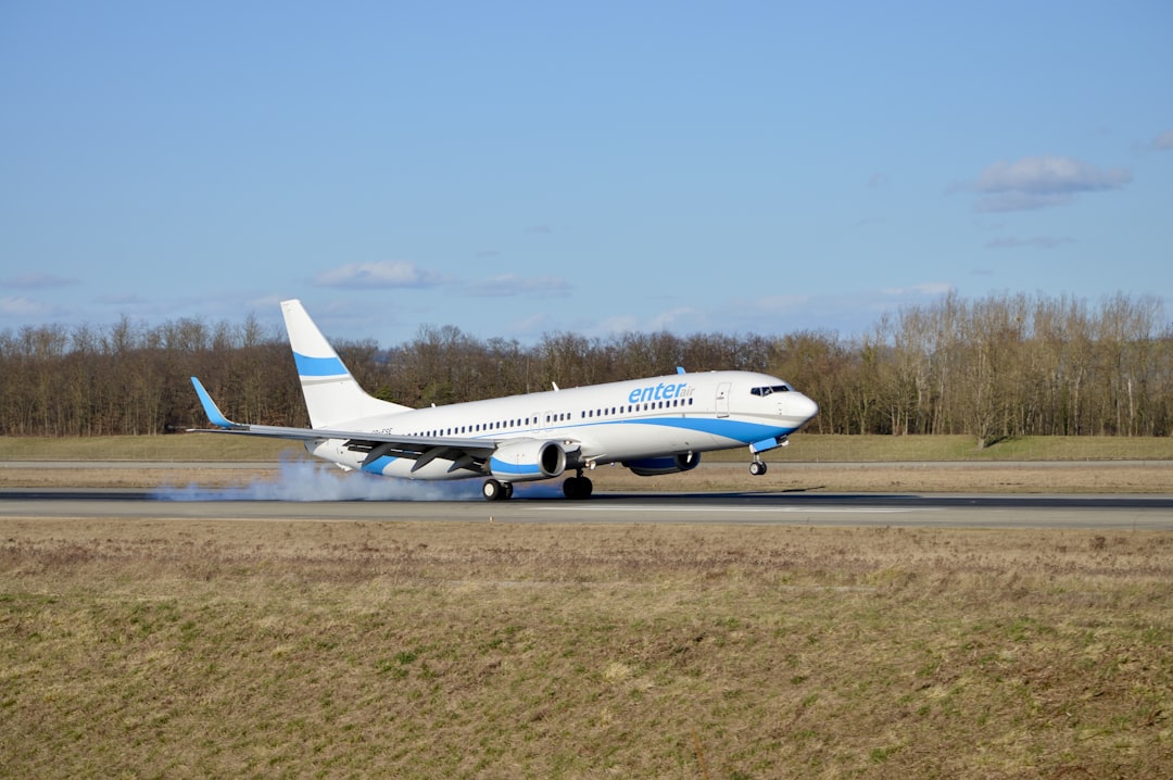 a large jetliner taking off from an airport runway,