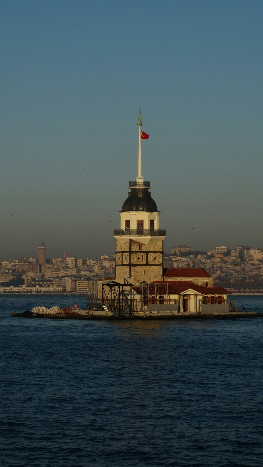 a large building sitting on top of a body of water