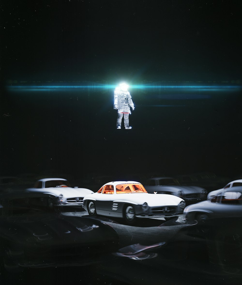 a car in a parking lot with an astronaut in the background