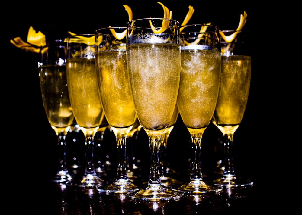 a row of champagne glasses filled with champagne