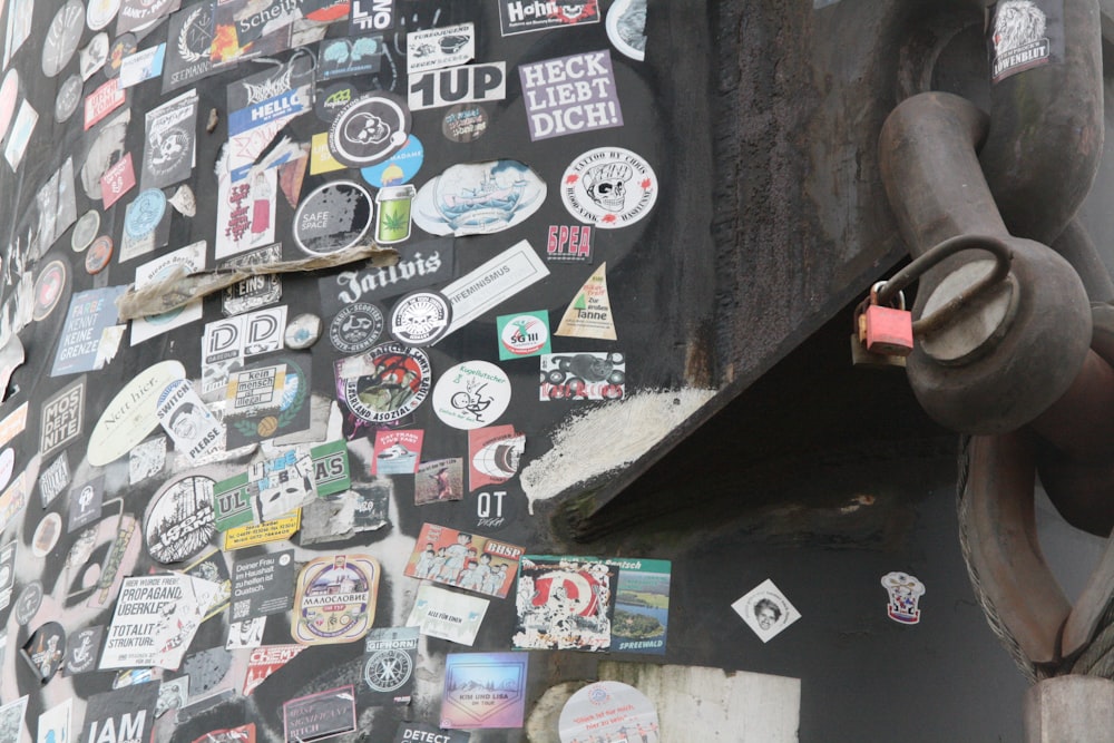 a close up of a building with a bunch of stickers on it