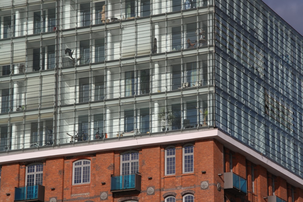 a tall building with many windows and balconies