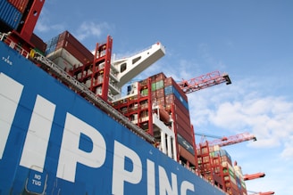 a large cargo ship with a crane on top of it