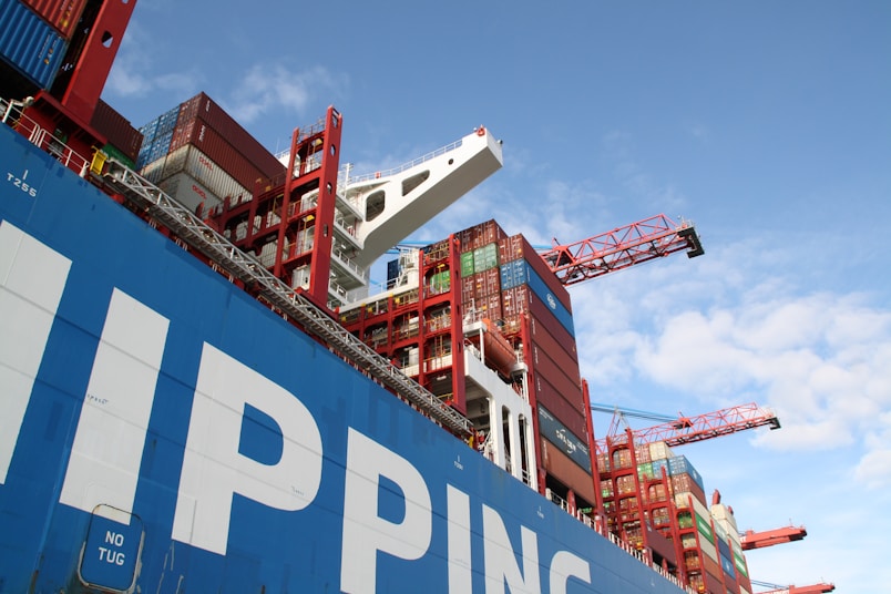 a large cargo ship with a crane on top of it
