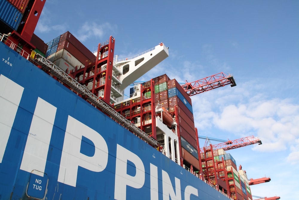 a large cargo ship with a crane on top of it