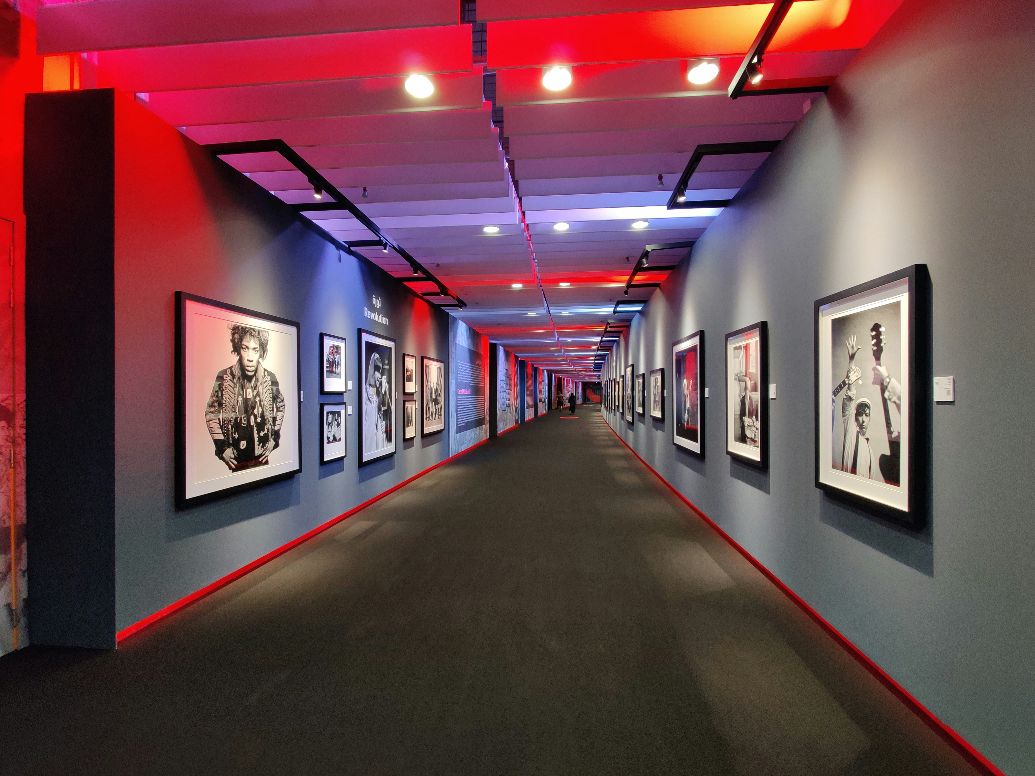 a long hallway with pictures on the walls
